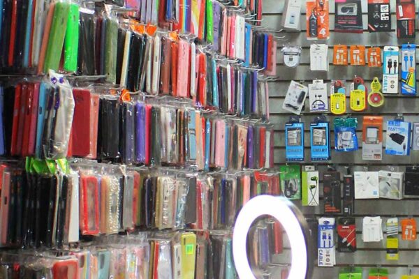 15. Cases, cables, chargers, speakers, lightning, earphones, are part of the smartphone economies in informal markets, Rio de Janeiro, Brazil. 2022