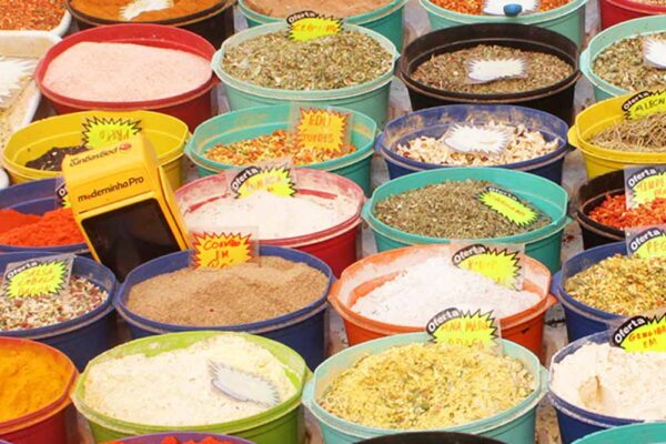 2. Portable card payment devices like this one in the picture between the spices are now widespread among formal and informal commerce. Street fair in the center of Rio, Rio de Janeiro, Brazil, 2022.